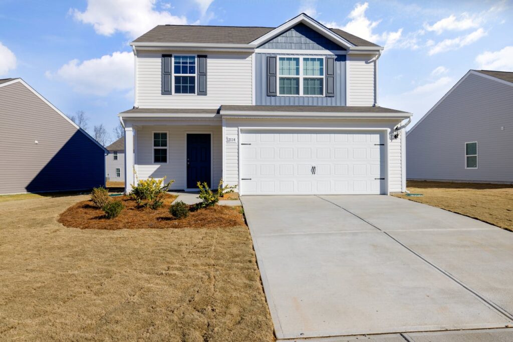 White and Blue House Under Blue Sky fix by Garage Door Repair Medford, NJ